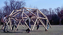Men carry a scaffold.