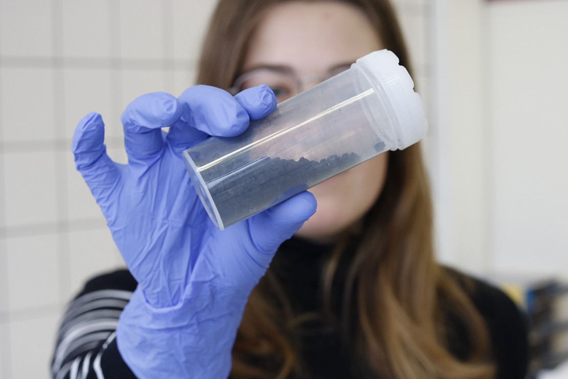 A researcher shows activated charcoal.